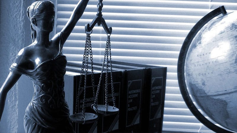 Whistleblowers Rights and Retaliation Laws - Scales of Justice, Legal Books, Globe